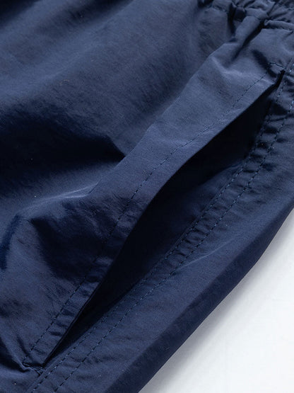 Set bestaande uit een overhemd met zeilprint geïnspireerd op de eilanden en bijpassende zwembroek.