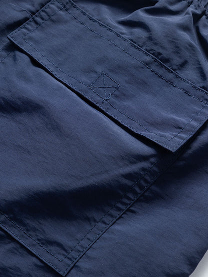 Set bestaande uit een overhemd met zeilprint geïnspireerd op de eilanden en bijpassende zwembroek.